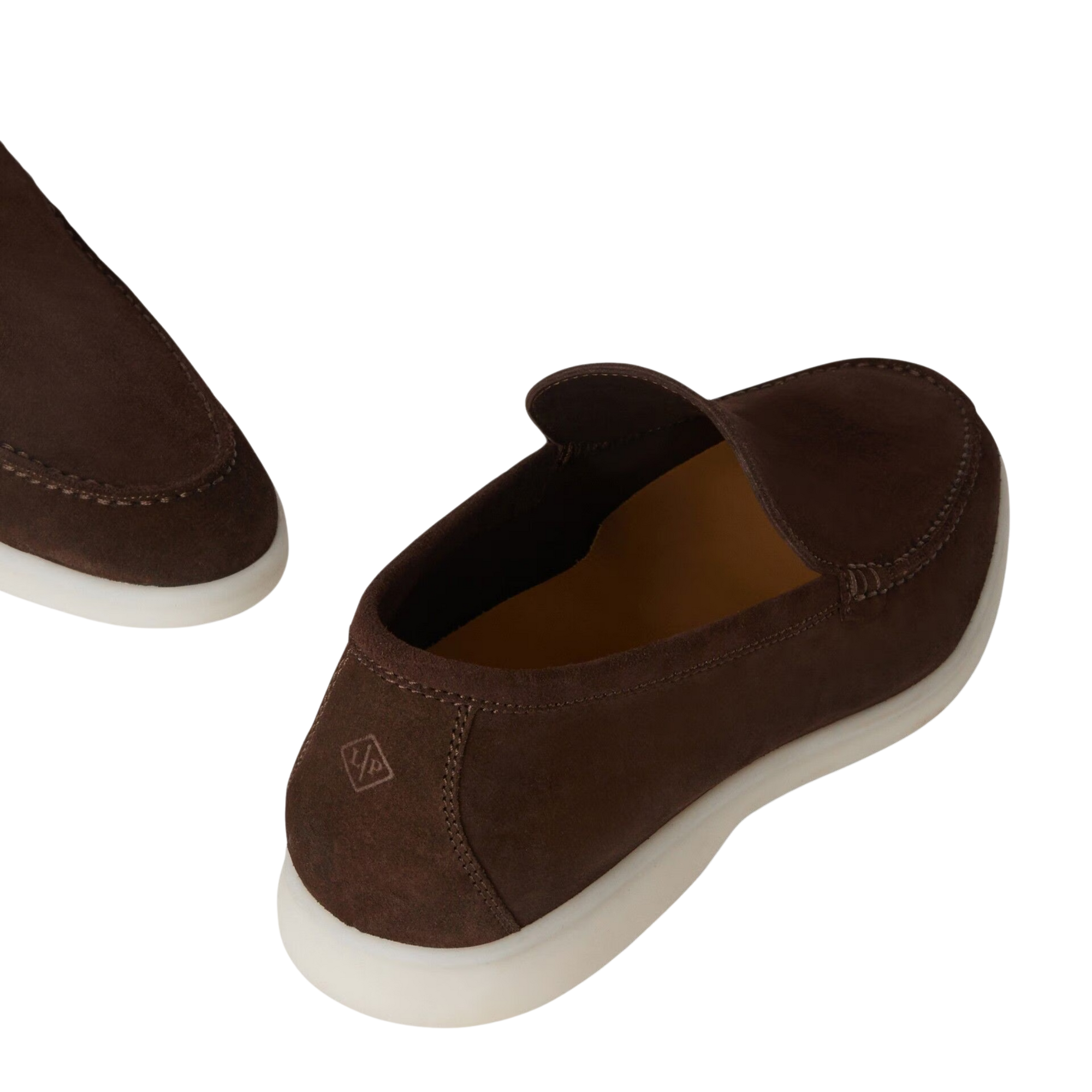 Brown slip-on shoes with a white sole on a white background