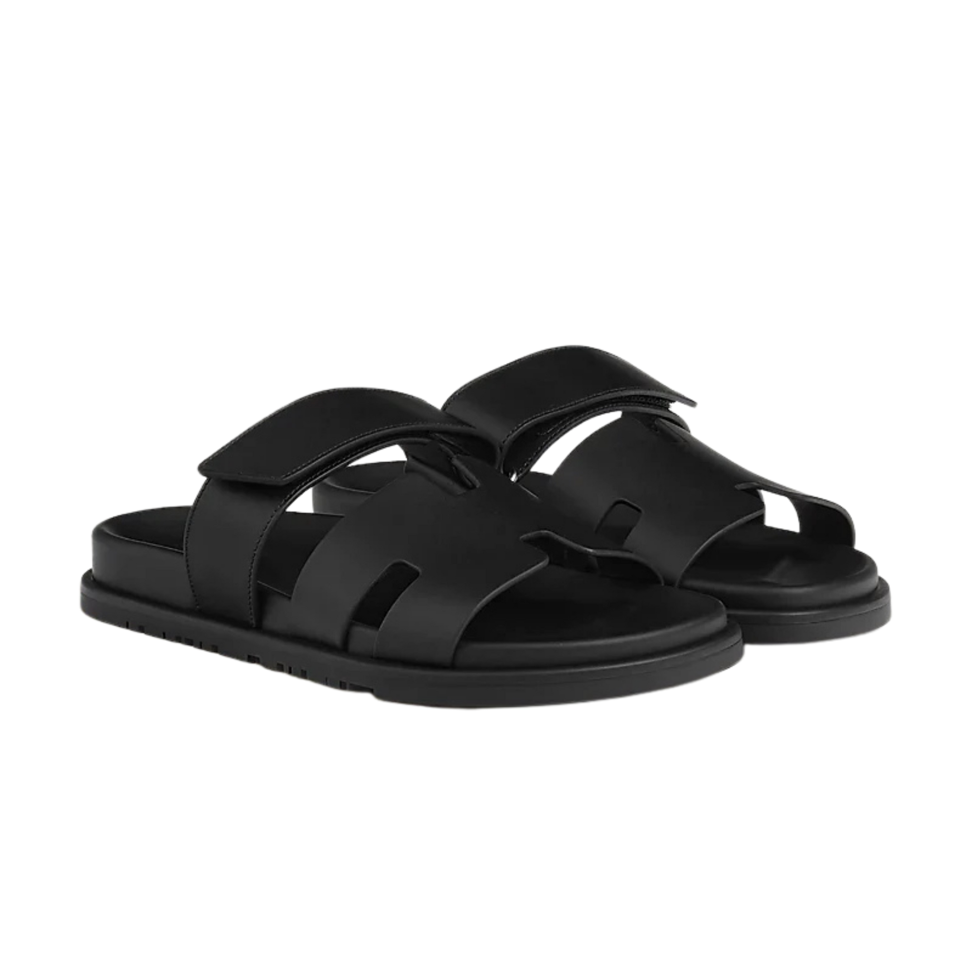 Black sandals with multiple straps on a white background