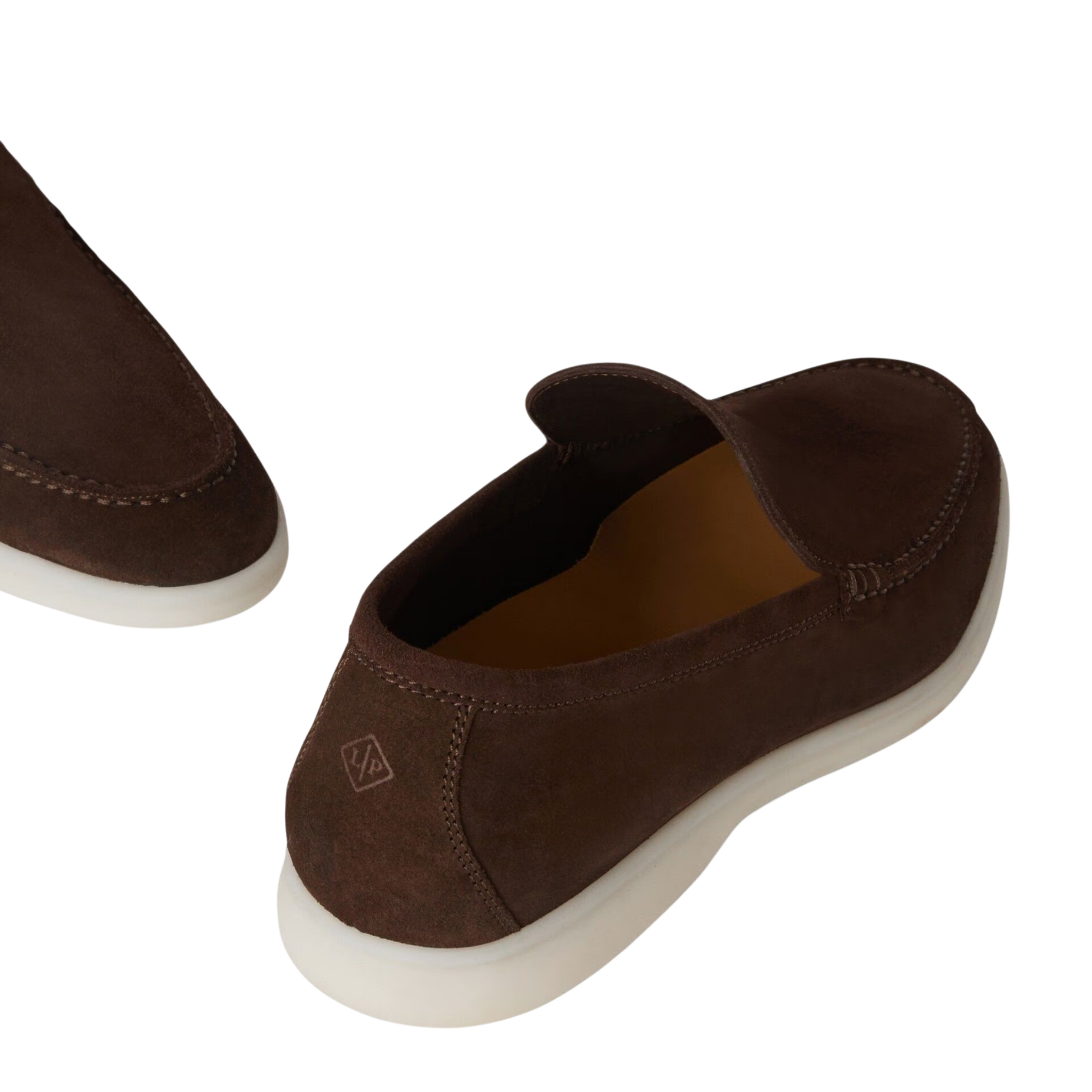 Brown slip-on shoes with a white sole on a white background