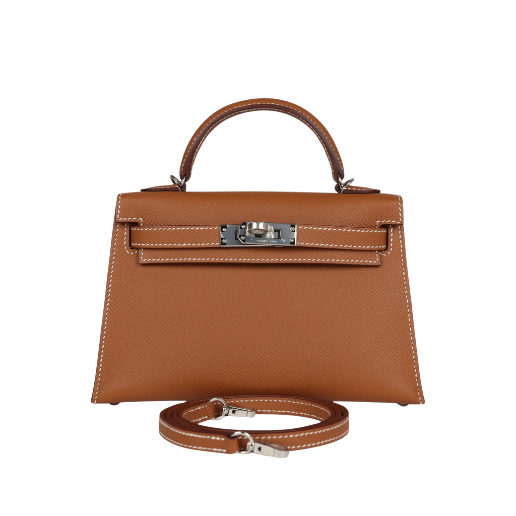 Brown handbag with a strap on a white background