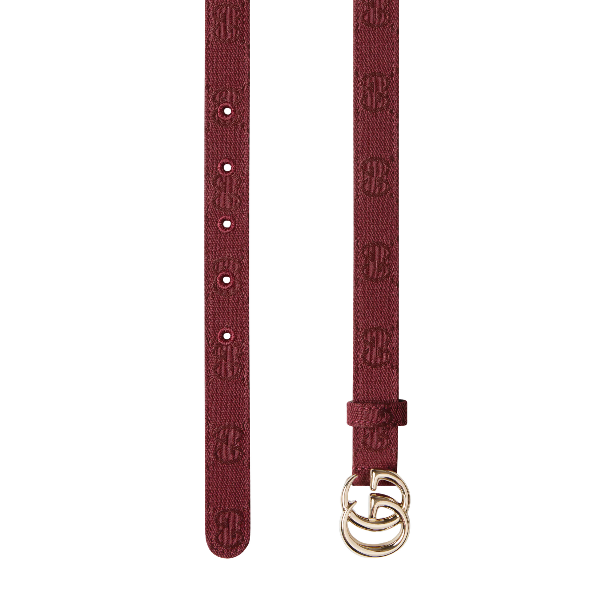 Thin brown women's belt with silver interlocking buckle on dress