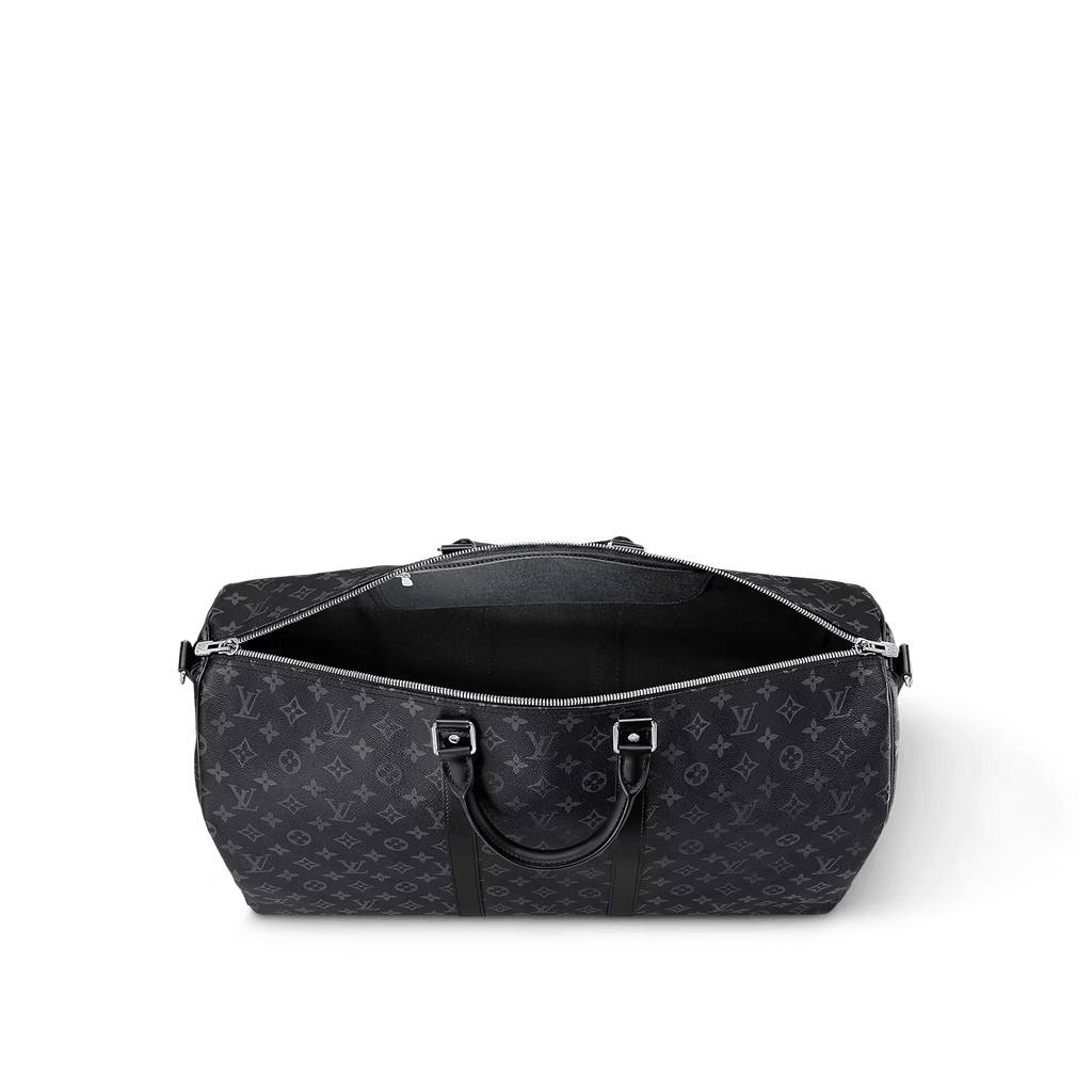 Luxury black travel duffle bag with detachable strap. Water-resistant, airline-approved size, and premium materials - the ultimate weekender bag for discerning travelers.
