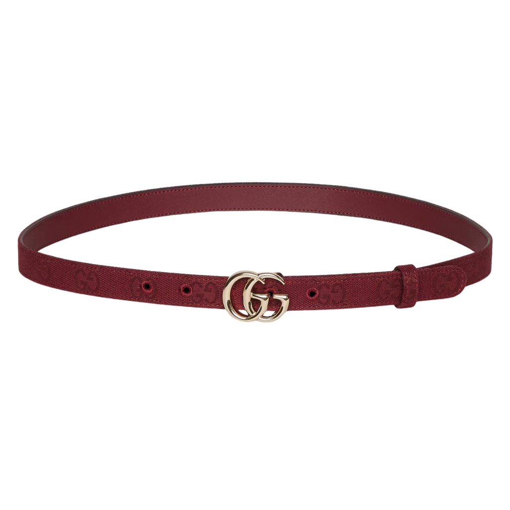 Thin brown women's belt with silver interlocking buckle on dress