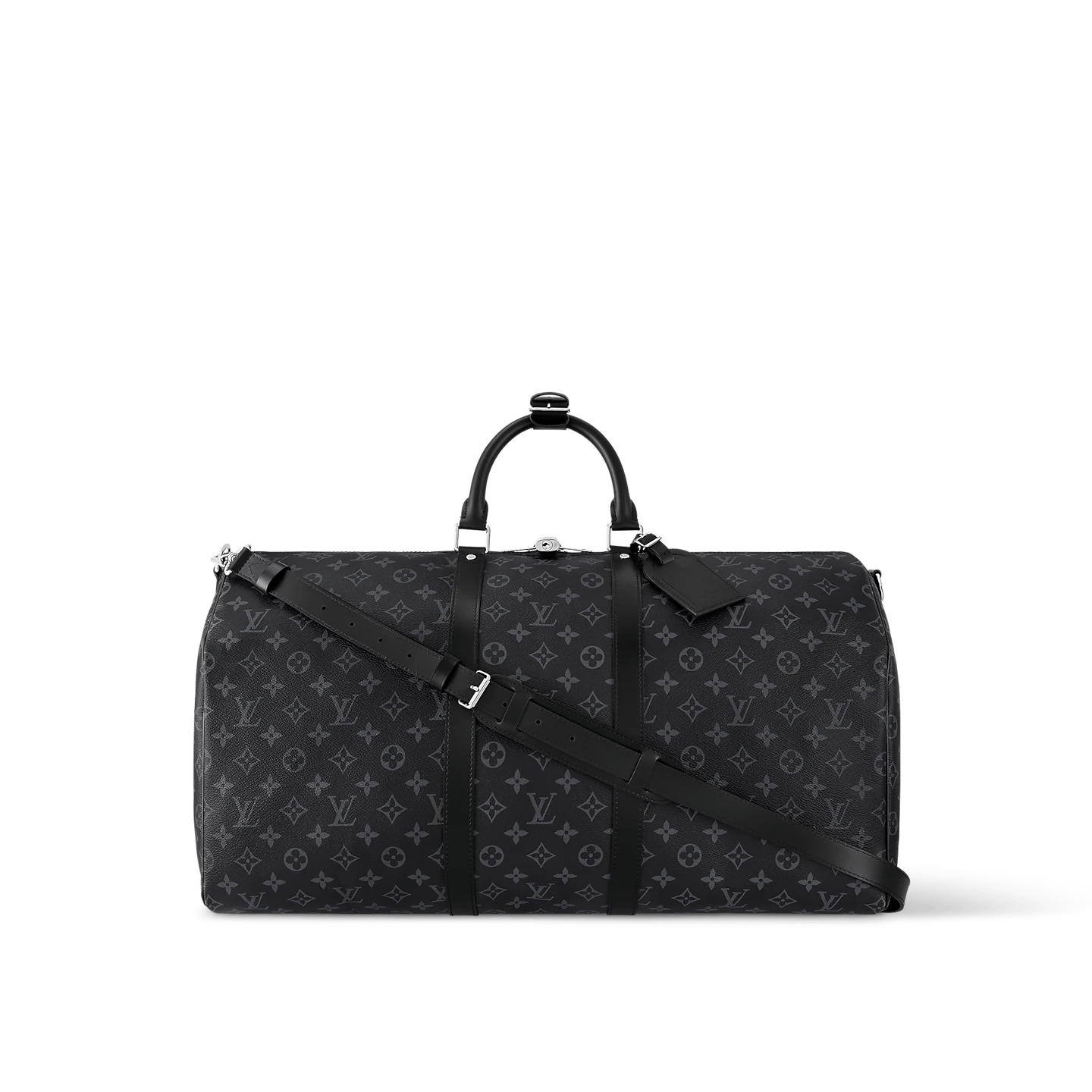 Black oversized weekender bag with leather handles and crossbody strap on luggage